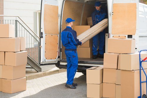 Student removals team loading boxes in a Ruislip residential street