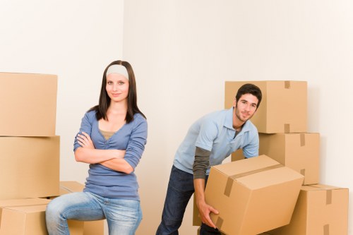Local packing team handling fragile household items