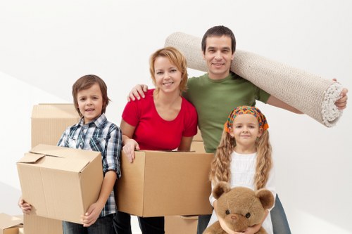 Local moving team handling boxes and furniture with care